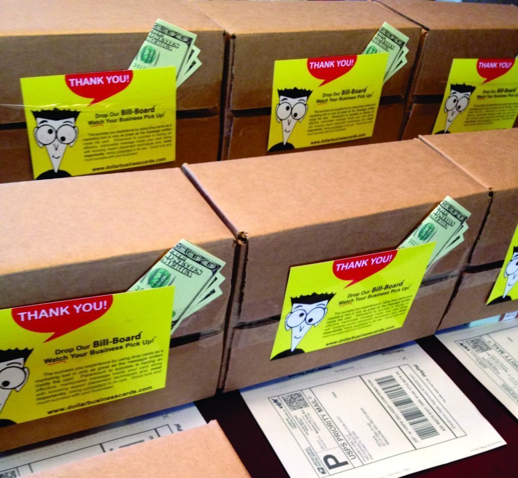 Packed U.S. Priority Mail boxes with “Thank you” inserts and die-cut Best Money Cards tucked under labels, ready for shipment.
